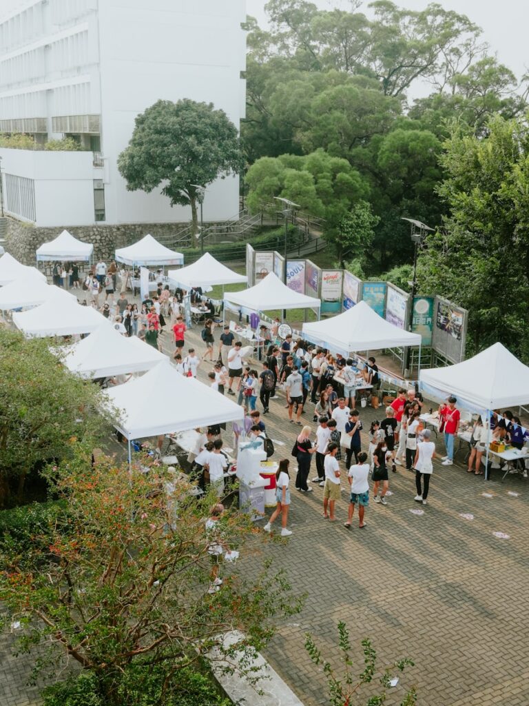 Students gathered around stalls and tents.